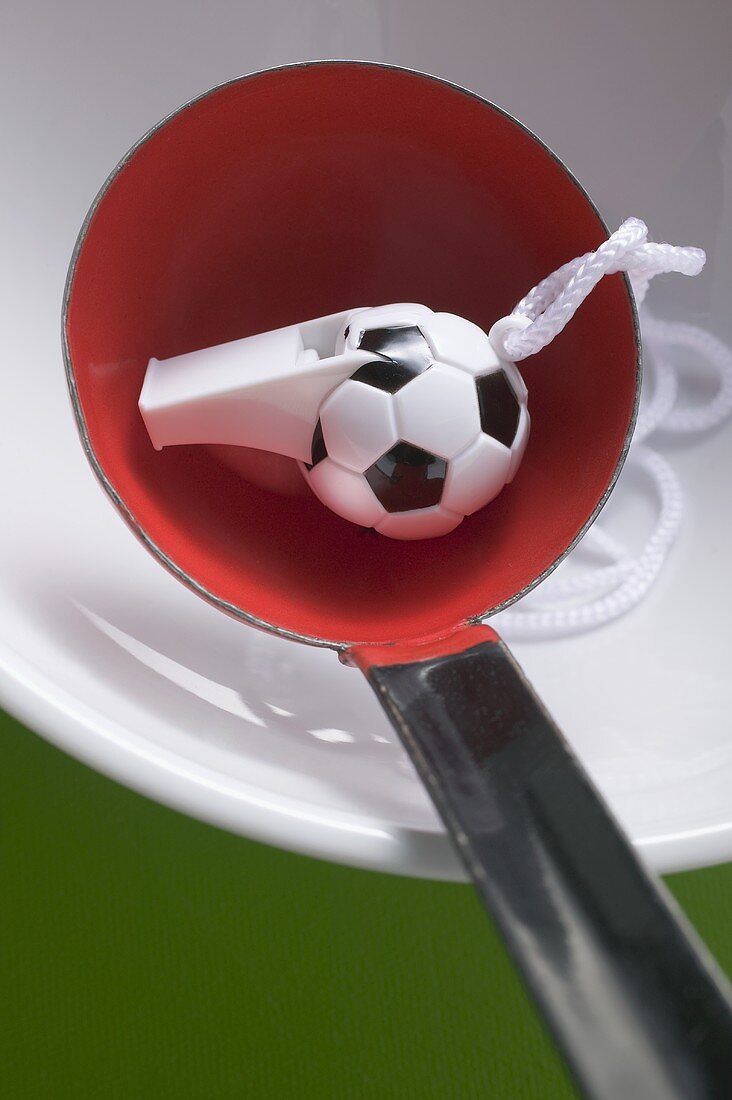 Football whistle in ladle