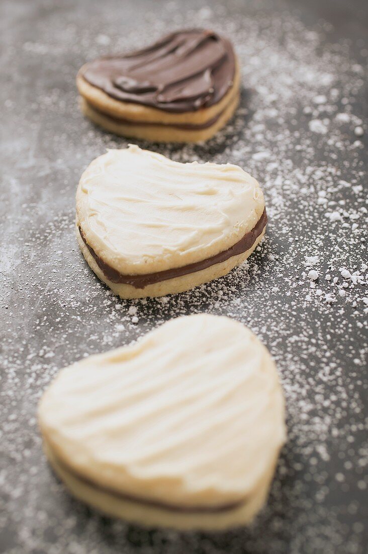 Three heart-shaped Christmas biscuits