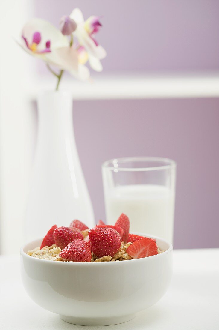 Strawberry muesli in white bowl