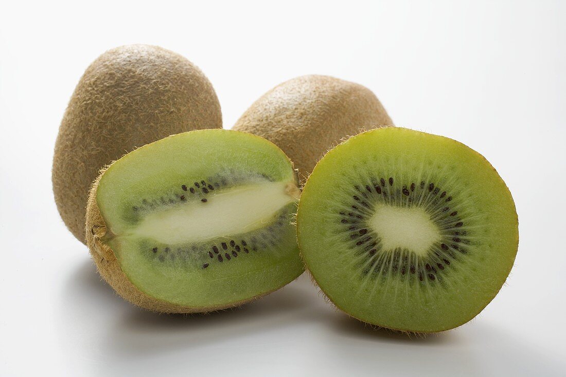 Kiwi fruits, whole and halved (lengthwise and crosswise)