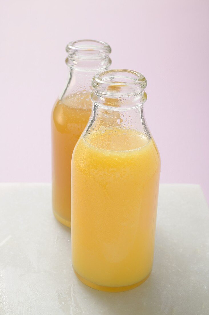 Two fruit juices in bottles