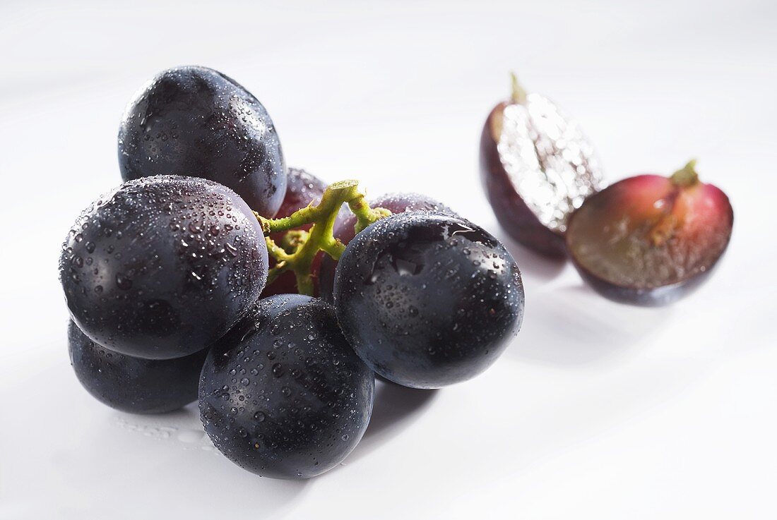 Black grapes with drops of water