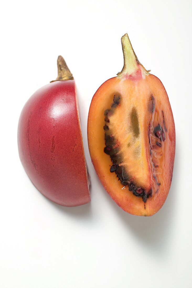 Two wedges of tamarillo (overhead view)