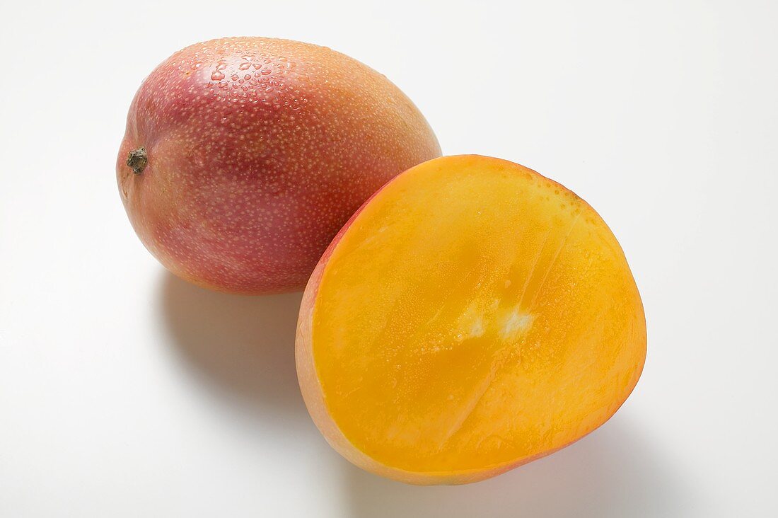 Whole mango and half a mango