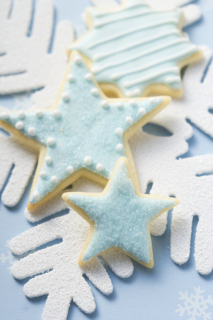 Three star biscuits with blue icing