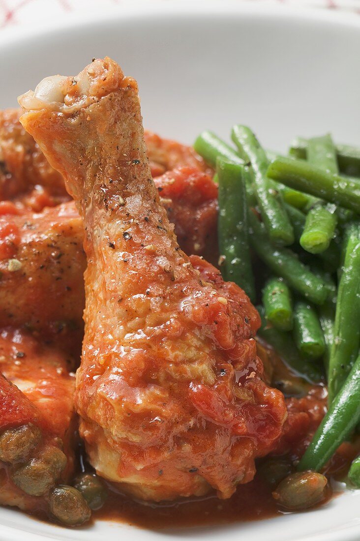 Chicken with tomato sauce, capers and green beans