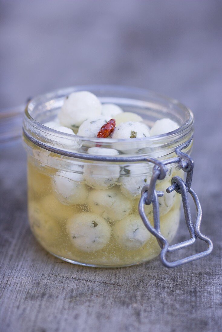 Marinated cheese balls in jar