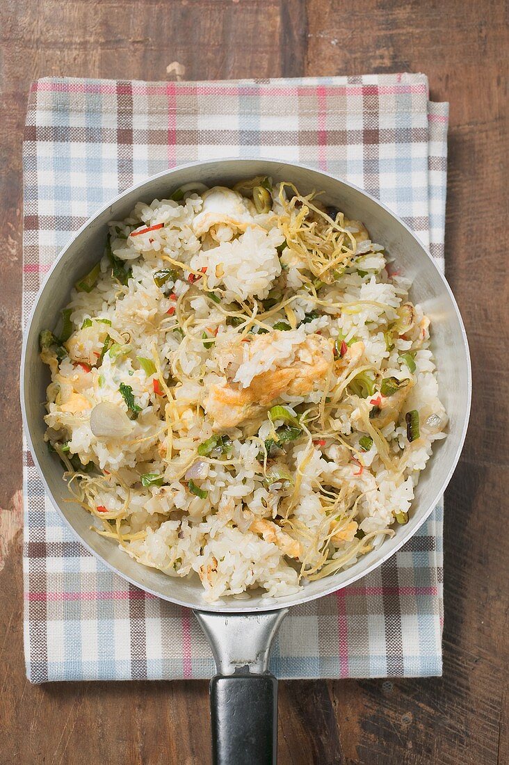 Pan-cooked rice and fish dish with lemon zest from above