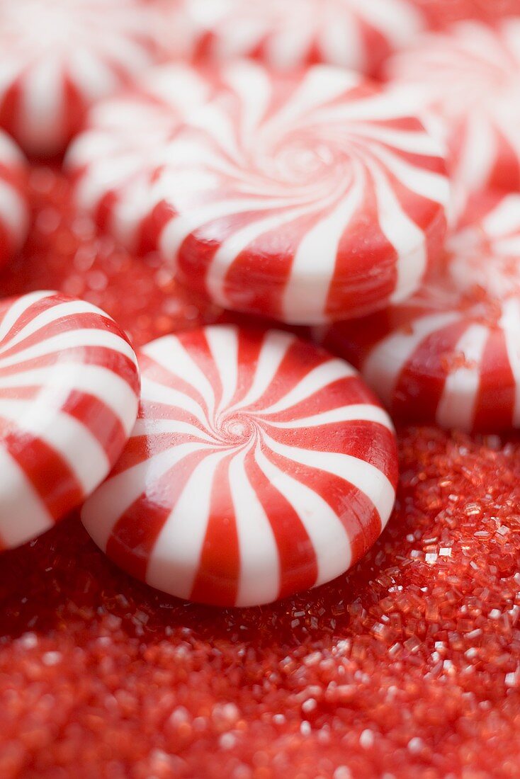 Peppermints on red sugar