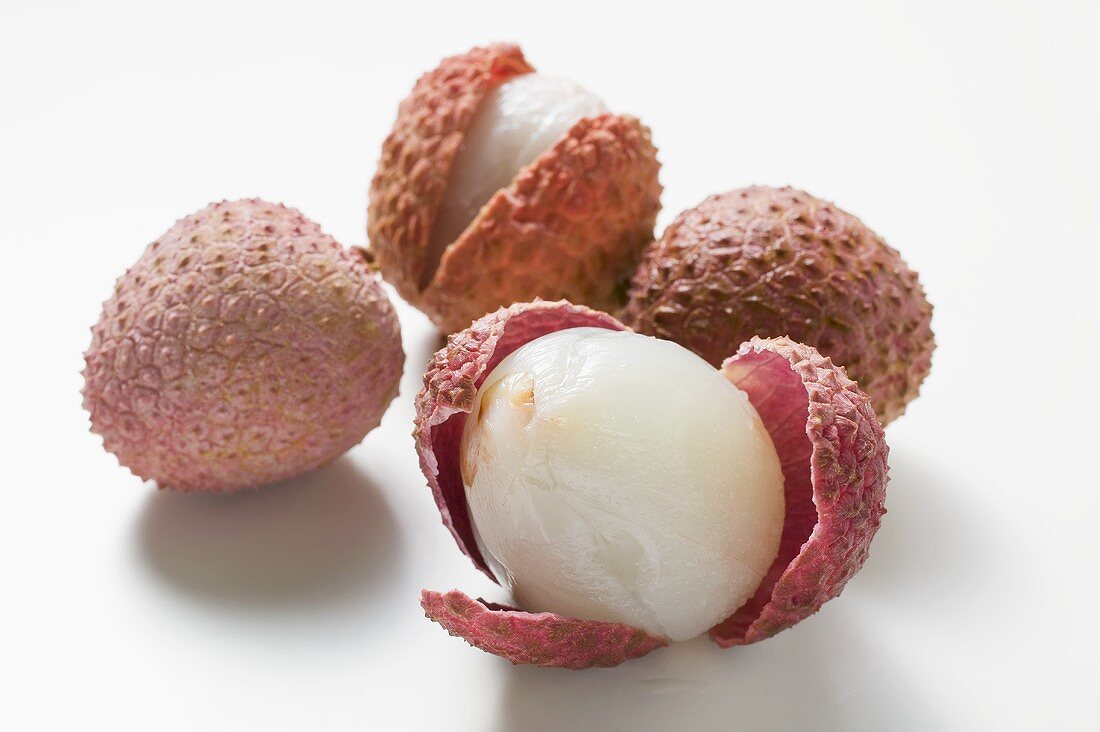 Lychees, whole and with opened peel