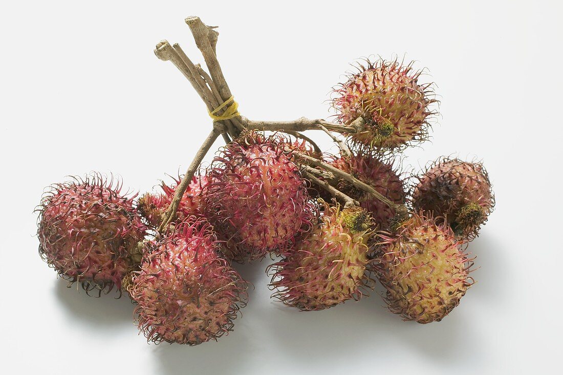 Several rambutans, tied in a bunch