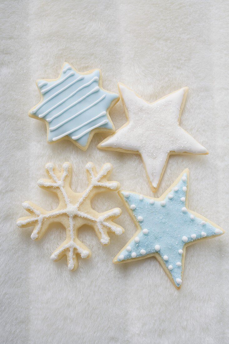 Four iced Christmas biscuits