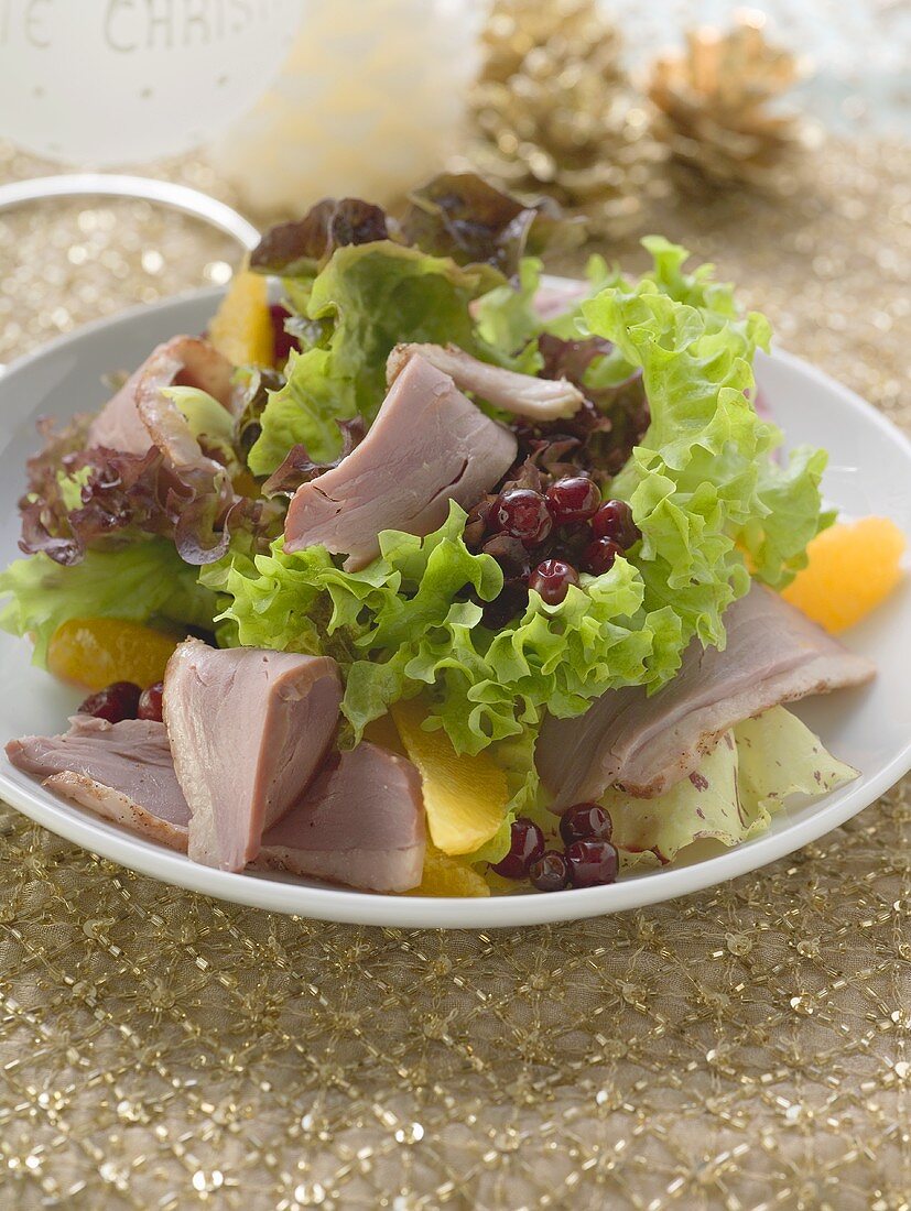 Salad leaves with duck breast and fruit (Christmas)