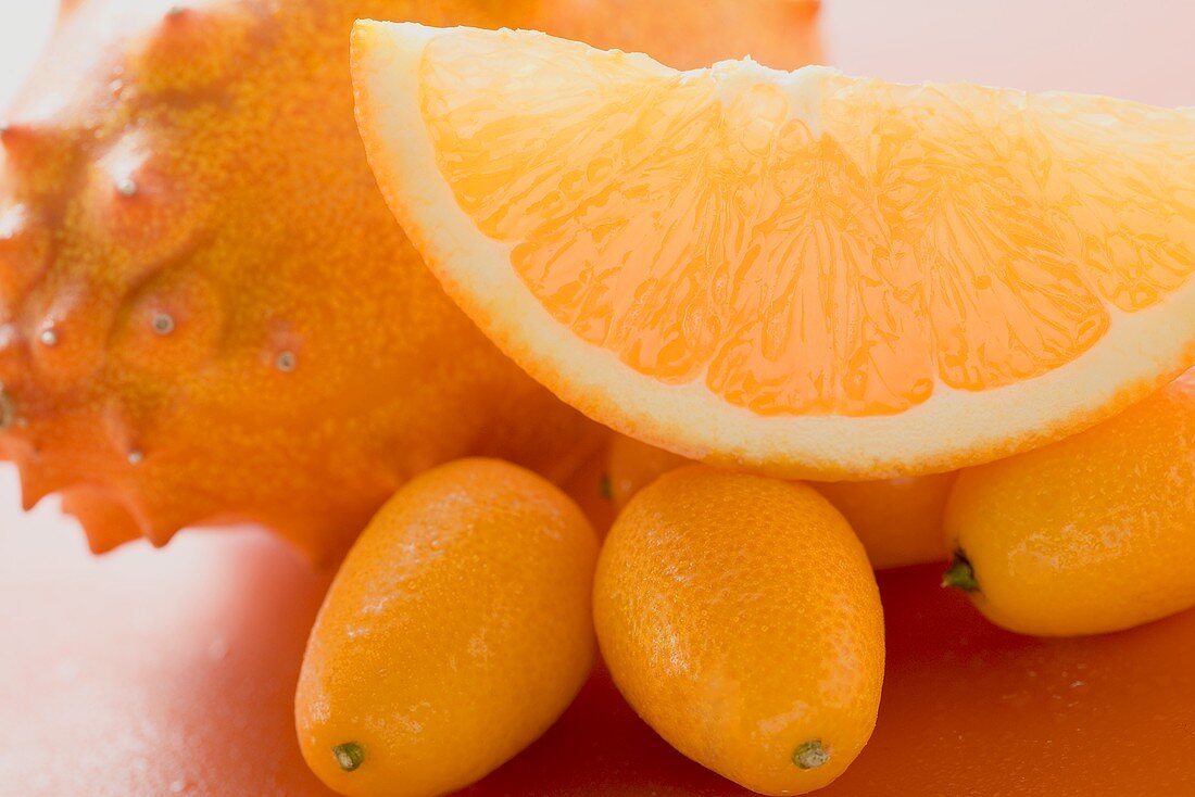 Kiwano, kumquats and wedge of orange