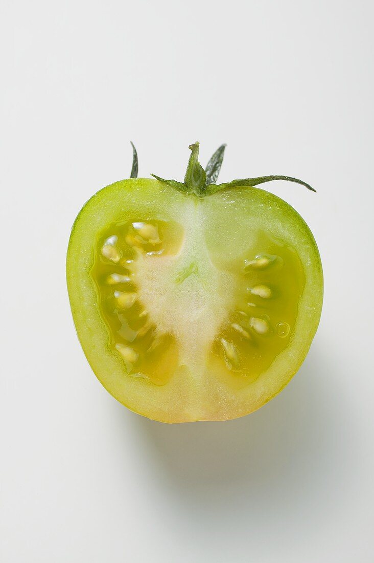 Half a green tomato (overhead view)