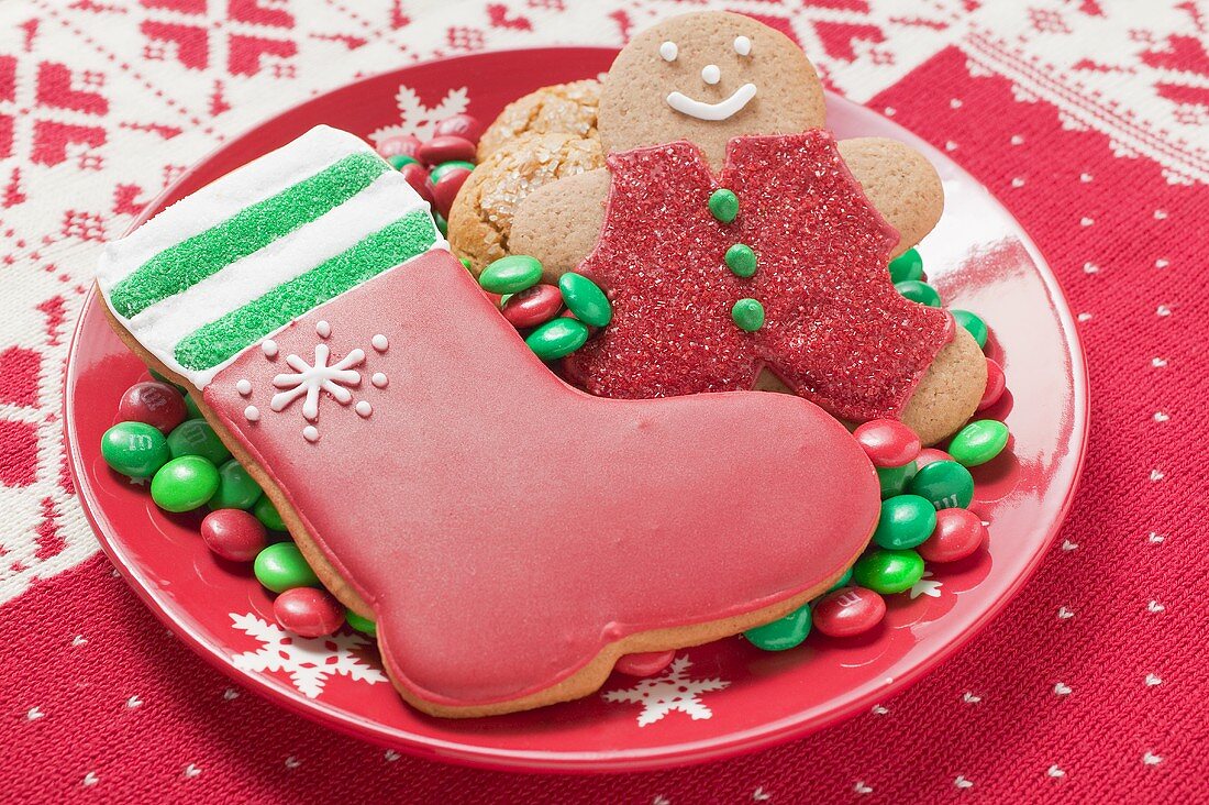 Christmas biscuits and chocolate beans on plate