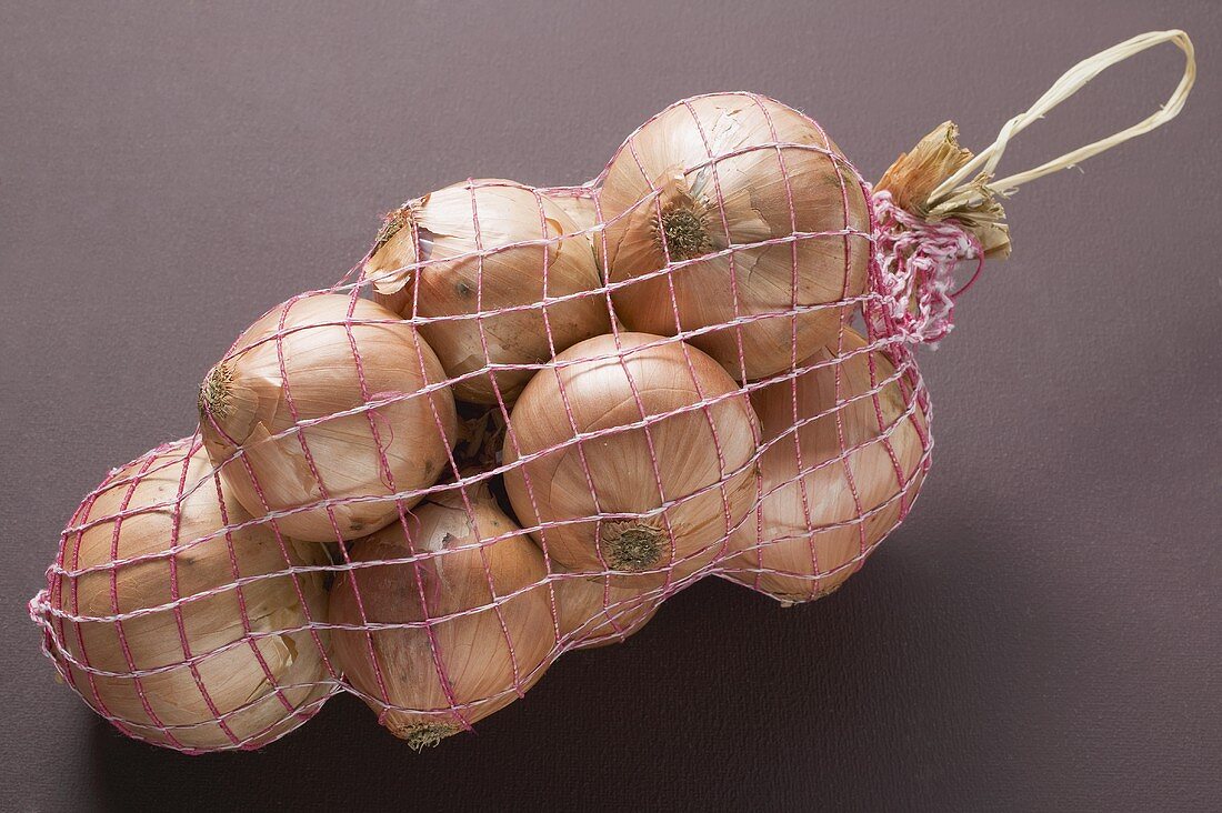 Brown onions in net