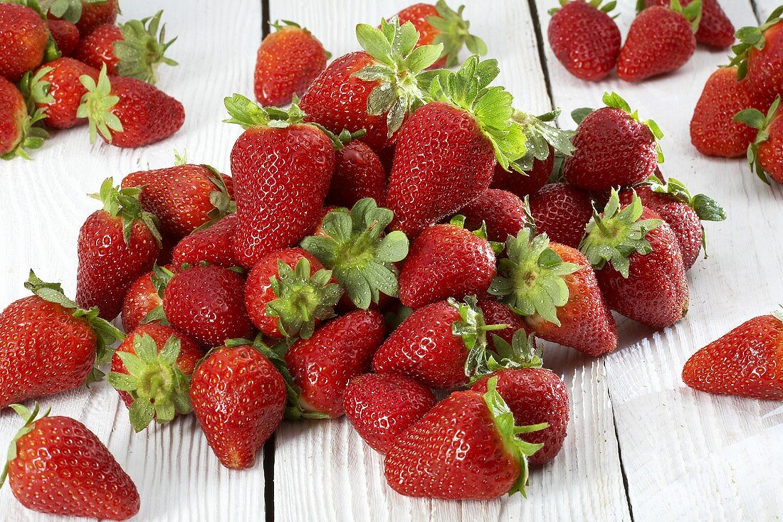 Fresh strawberries on white wood