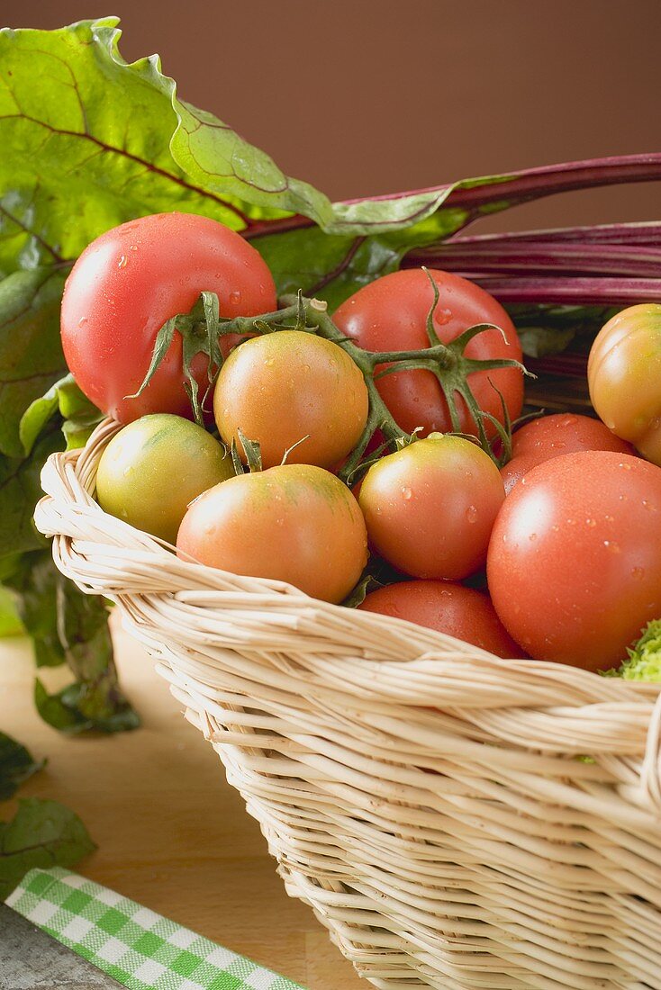 Fresh tomatoes and beetroot in basket