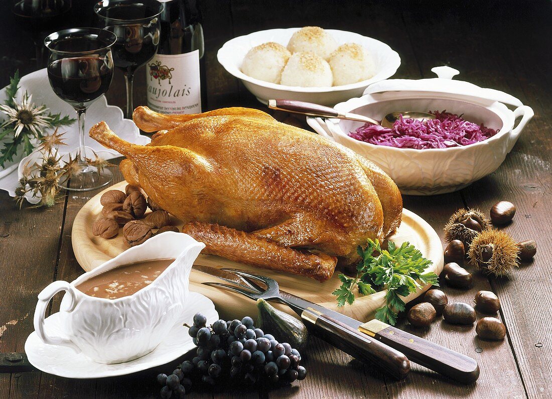 Roast goose with chestnut stuffing, red cabbage & dumplings