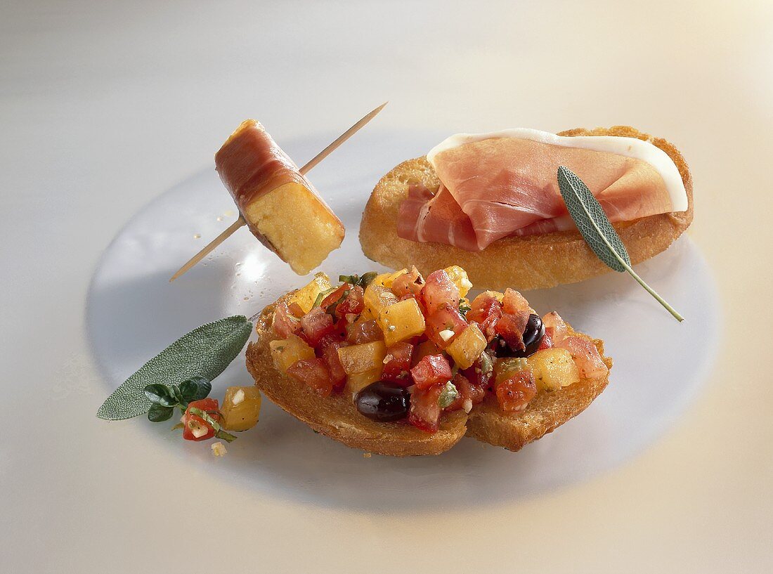 Bruschetta, Parma ham on bread and fried polenta cube