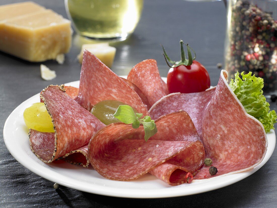 Slices of salami on plate