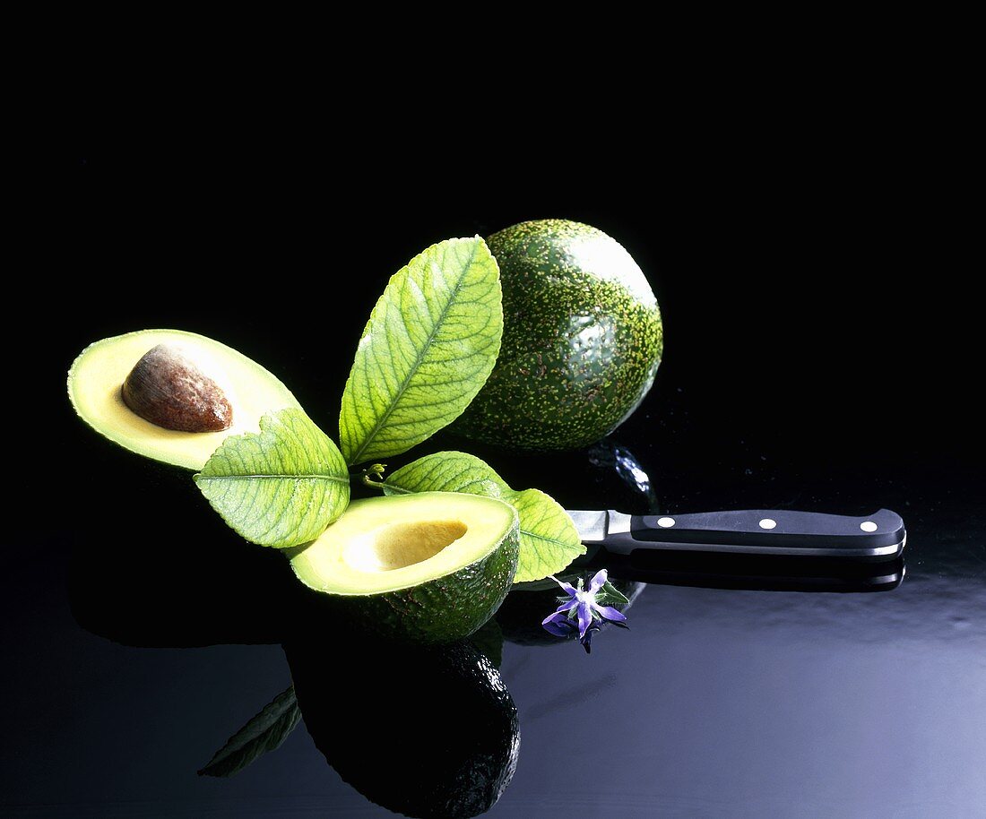 Avocados, whole and halved
