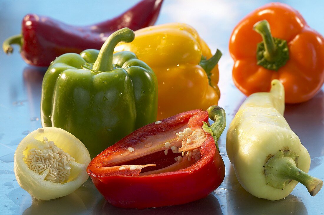 Various types of peppers, whole and halves