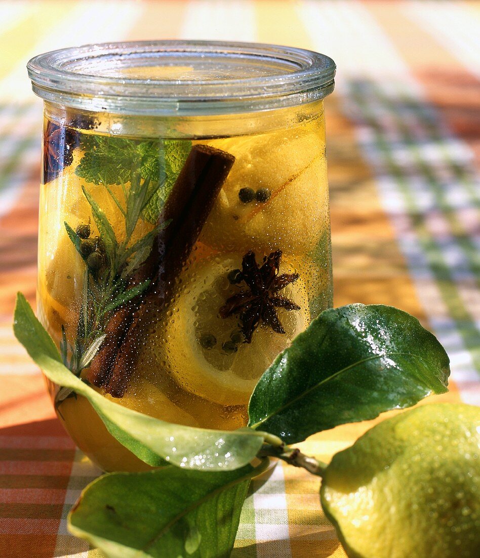 Lemon slices with star anise, cinnamon sticks & lemon balm