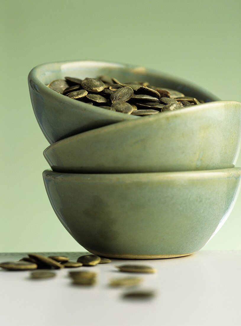 Pumpkin seeds in green bowl