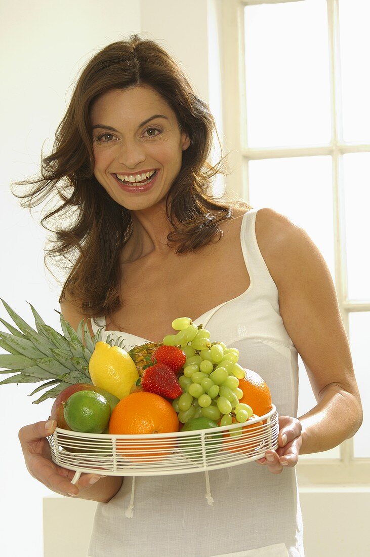 Woman with fresh fruit