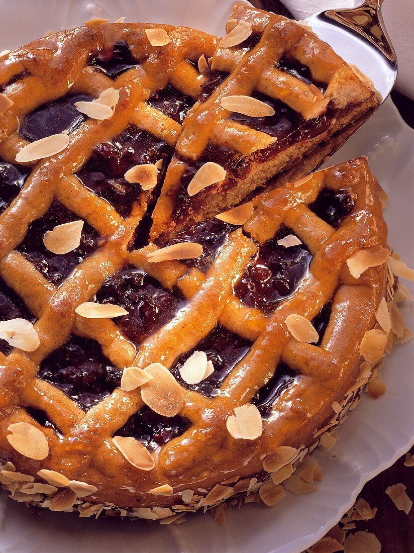 A Linzer tart with flaked almonds