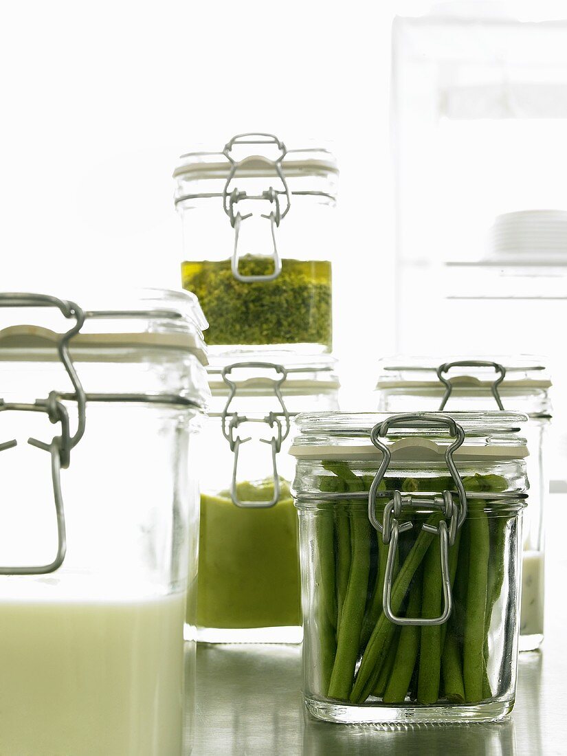 Green beans and sauces in preserving jars