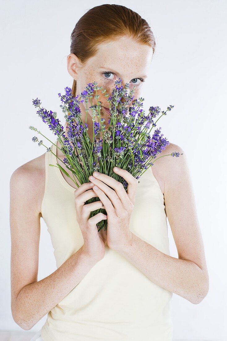 Young woman with a bunch of lavender