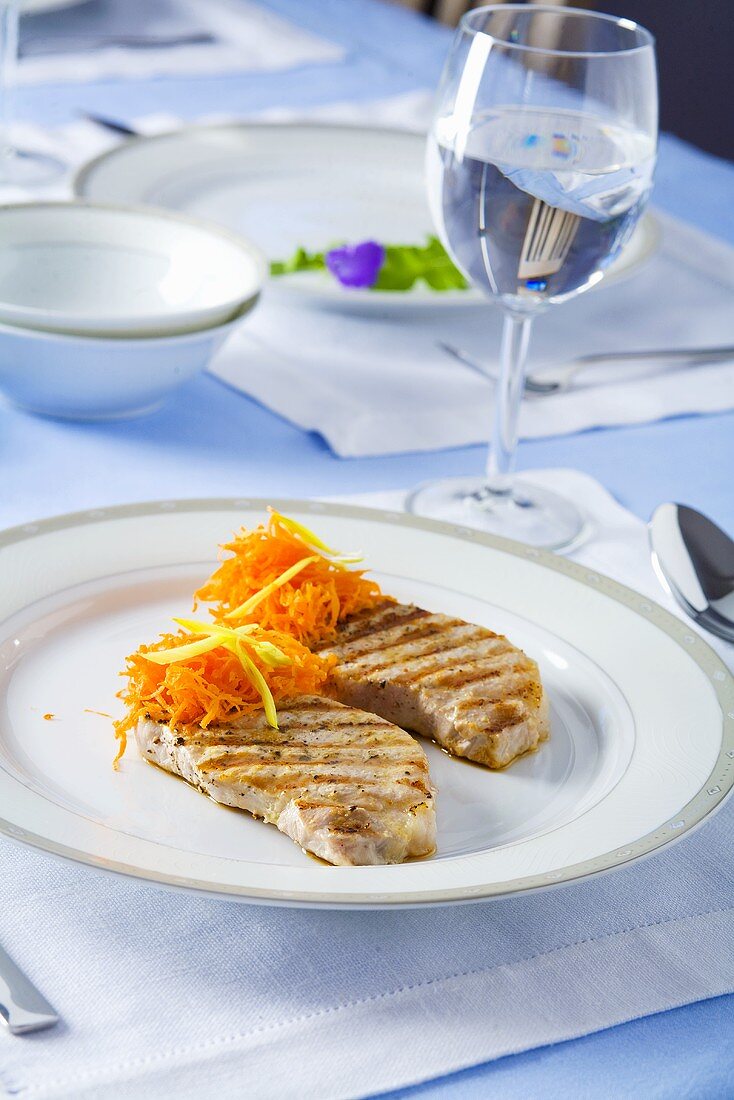 Grilled pork loin chops with grated carrots