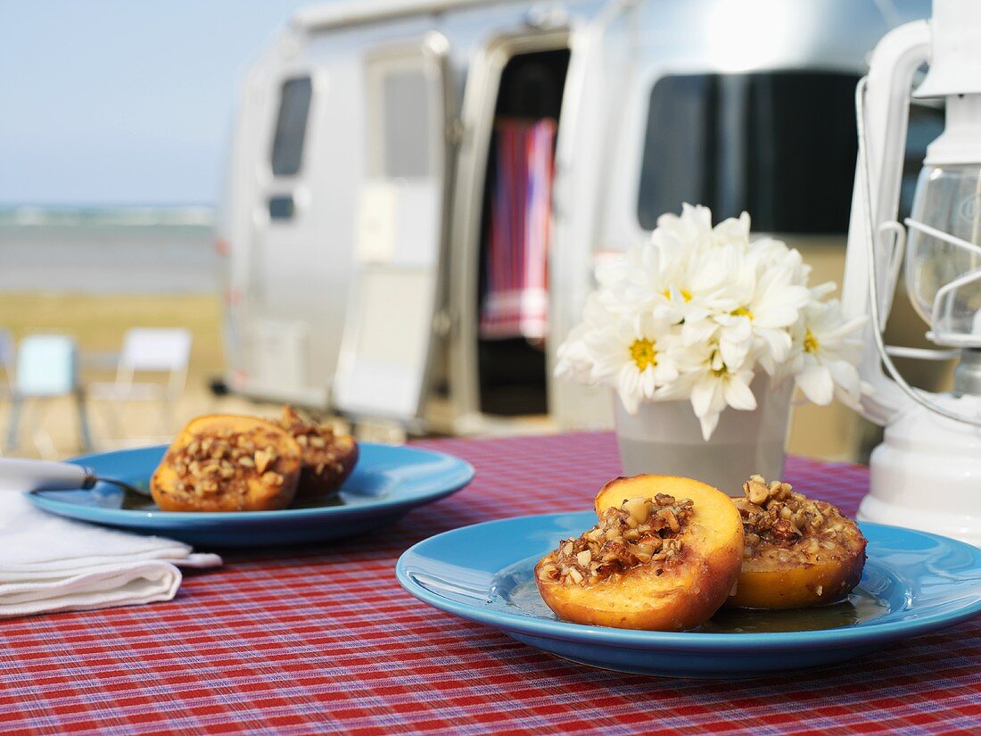 Baked peaches with nut stuffing, camper van in background