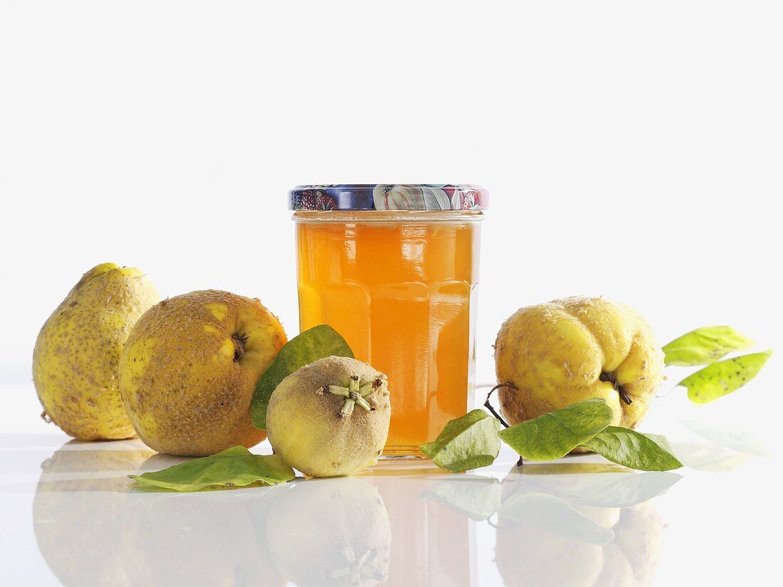 Still life with quince jelly and quinces