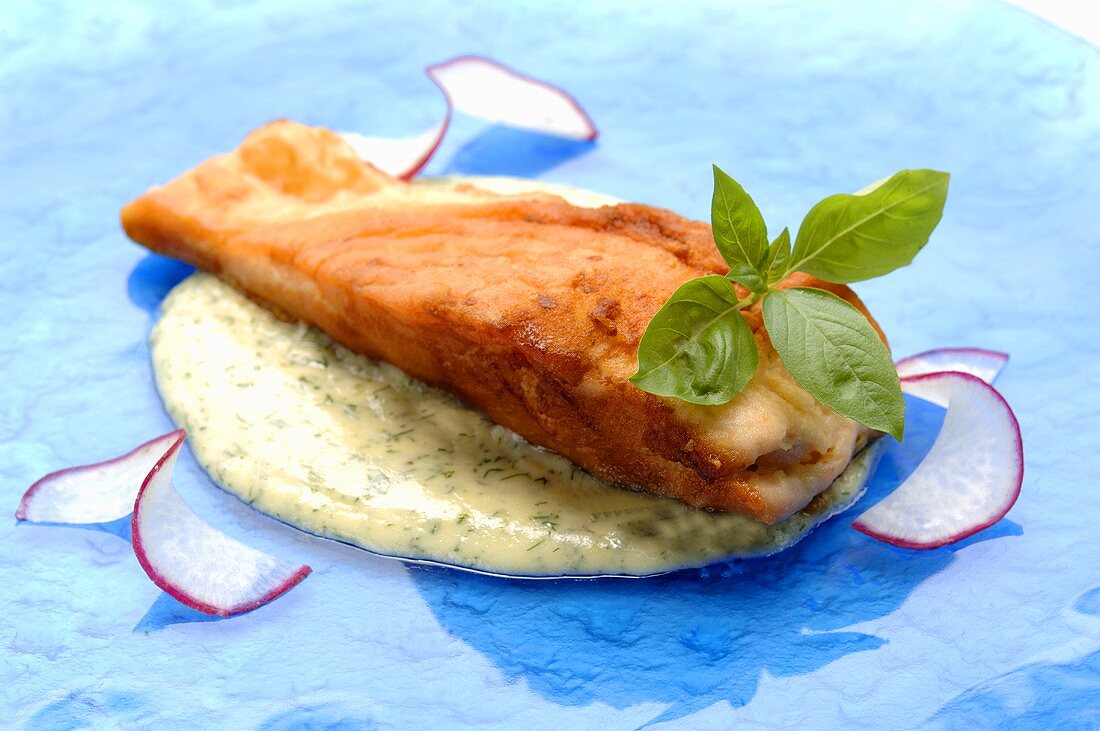 Salmon steak on dill sauce