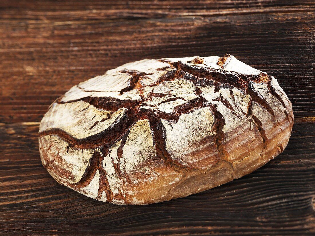 Rustic bread on wooden background