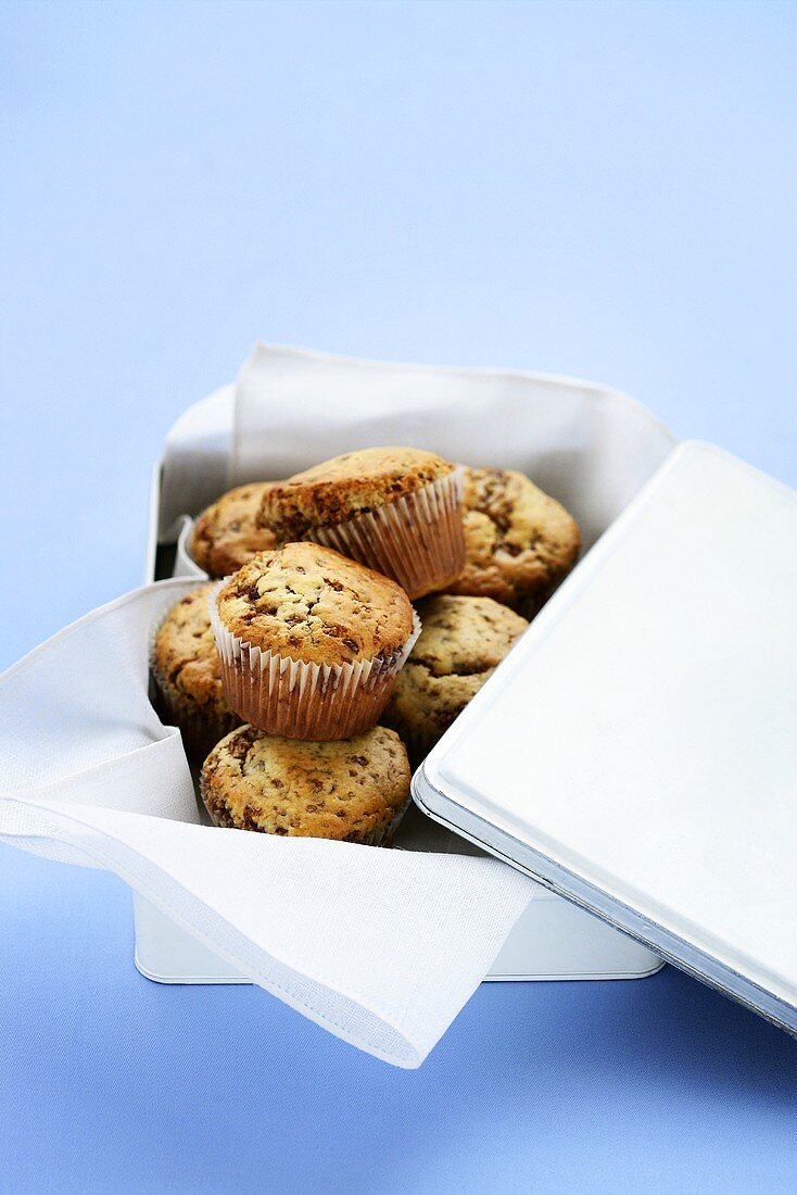 Chocolate chip muffins in a picnic tin