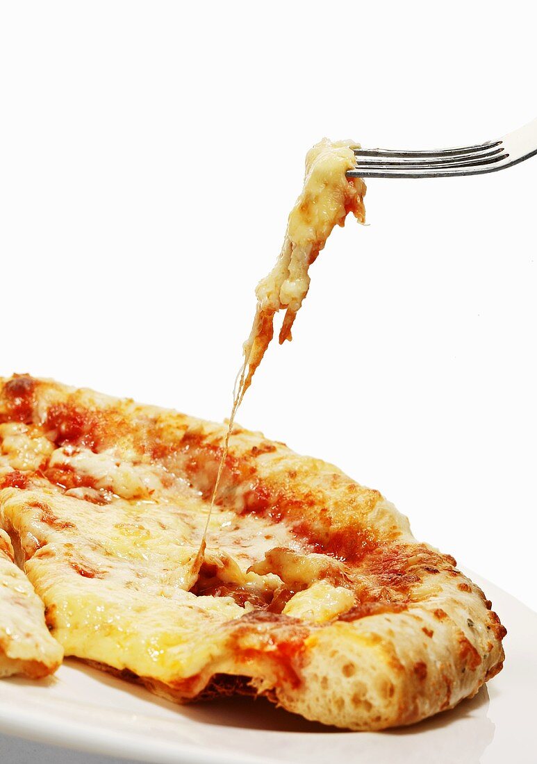 A slice of pizza with cheese strings on a fork