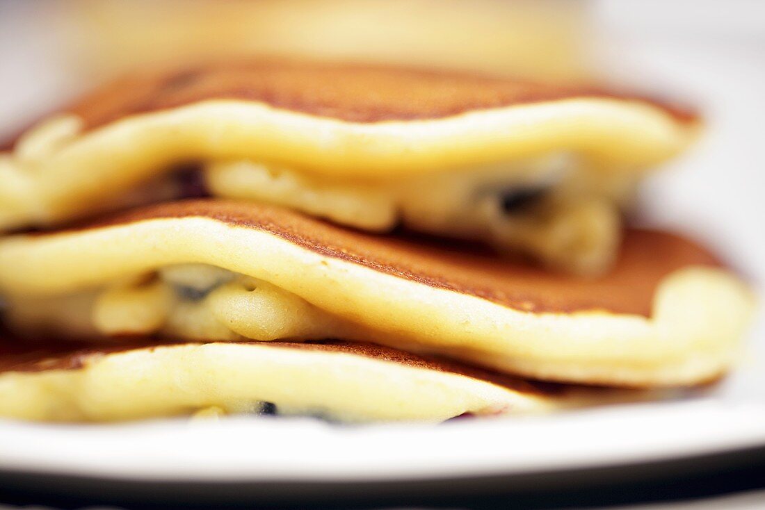 A stack of blueberry pancakes