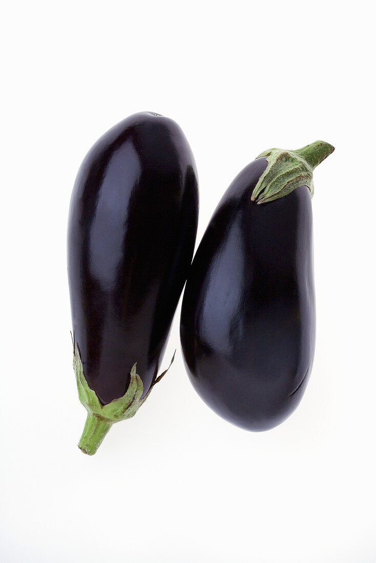Two Whole Eggplant on a White Background