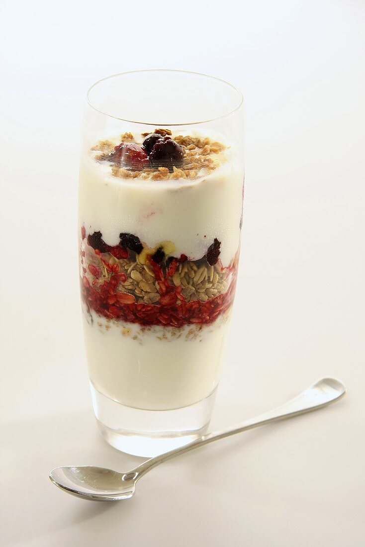 Layered dessert with yogurt, cereals and raspberries