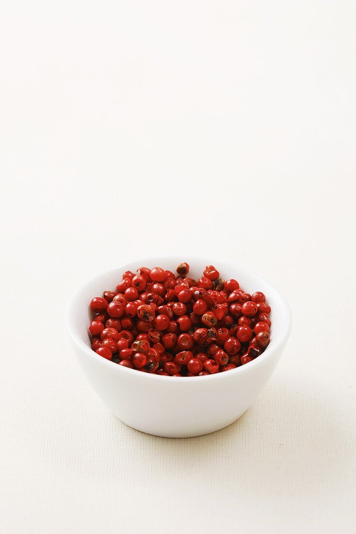 A bowl of pink peppercorns