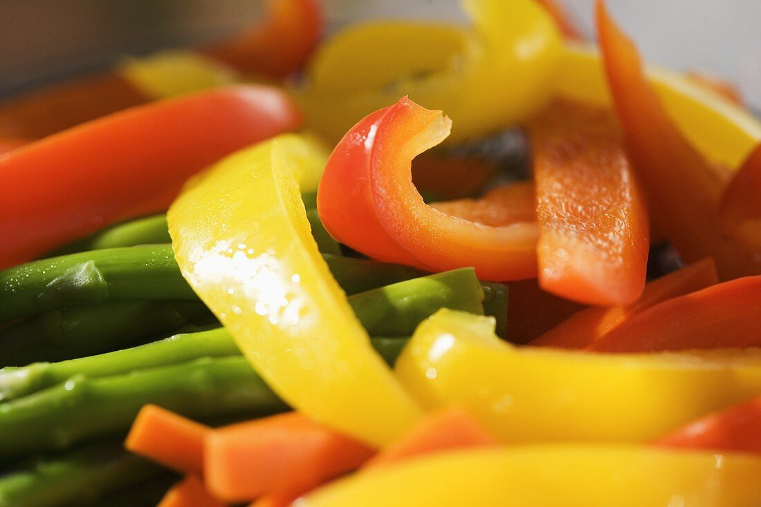 Sliced Yellow and Orange Bell Peppers with Asparagus