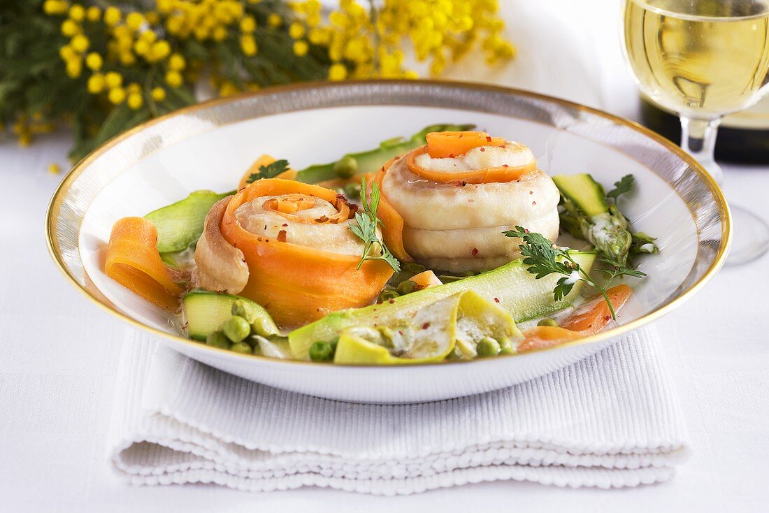 Sole rolls with spring vegetables