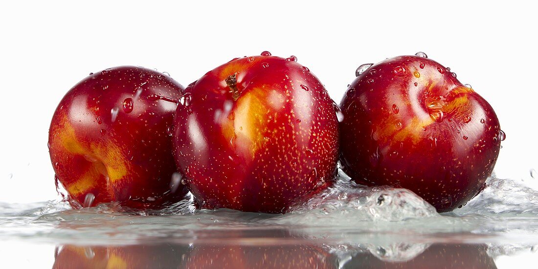 Three plums in water