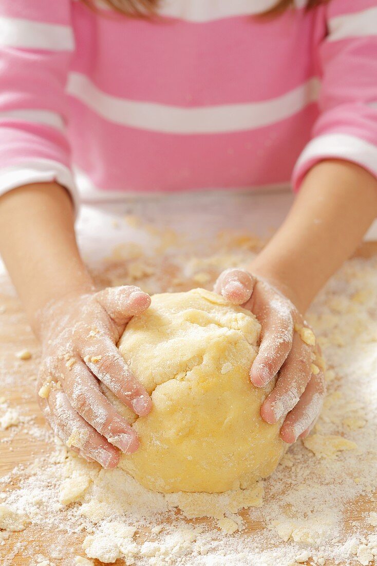 A girl kneading shortbread