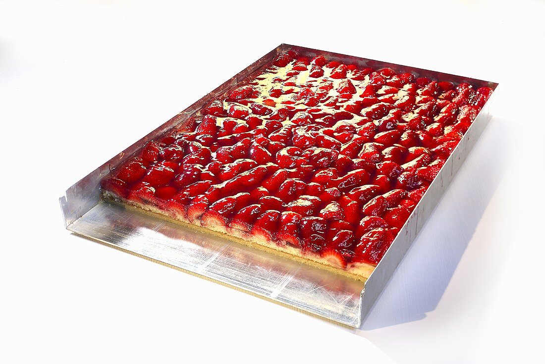 Strawberry cake on a baking tray